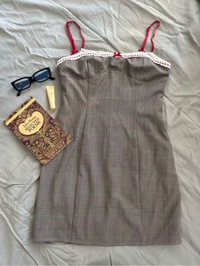 Plaid lined Dress with red and lace Trim with bow strap accents